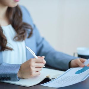 a woman writing up some paperwork